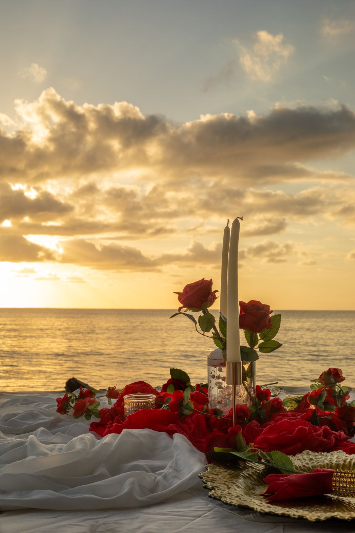 Beachside dinner setting at sunset